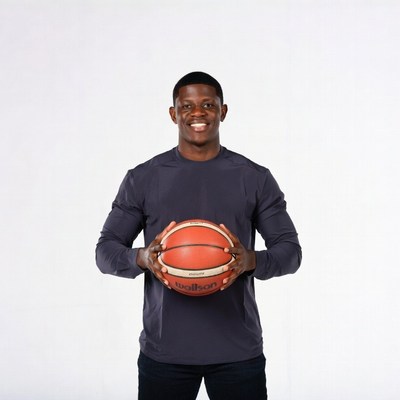 African-American man holding basketball