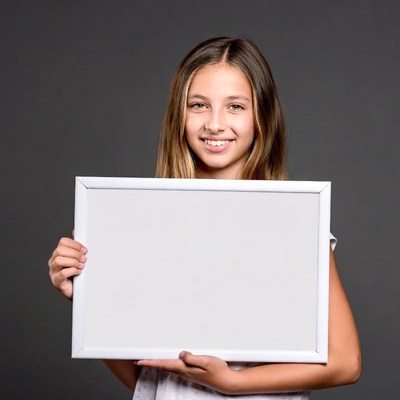 Girl holding blank white sign