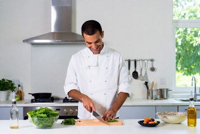 Chef chopping vegetables in kitchen