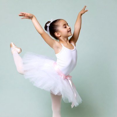 Young girl dancing in ballet pose