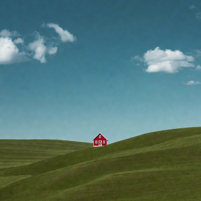 Red house on green hills