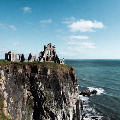 Ruins of Whitby Abbey on Cliff Overlooking Sea