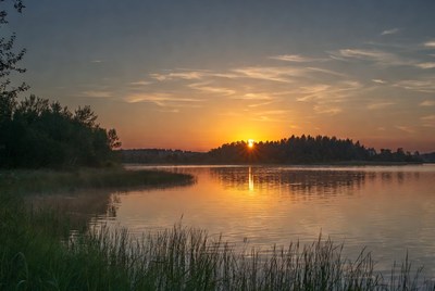 Sunset over lake with trees