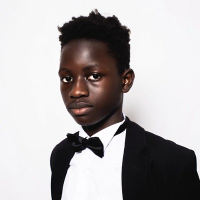 African boy in tuxedo bowtie