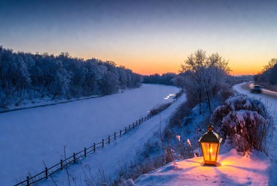 Lit Lantern on Snowy River Bank