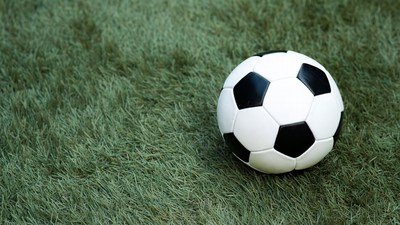 Soccer ball on green grass