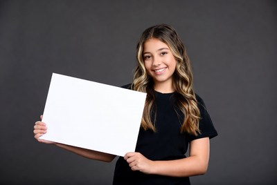 Girl holding blank sign