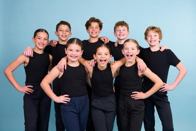 Group of kids posing in black dancewear