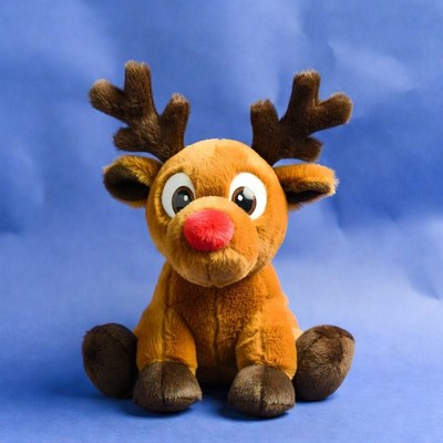 Cute plush reindeer on blue background