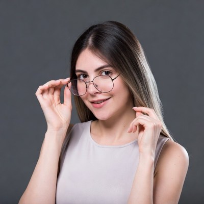 Woman holding glasses smiling