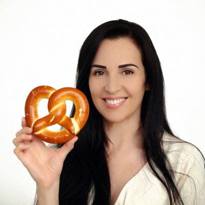 Woman holding giant pretzel