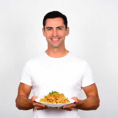 Man holding plate of spaghetti