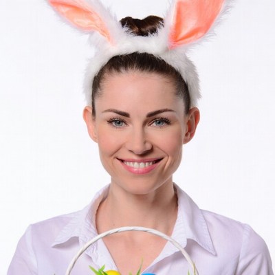 Woman holding Easter basket with bunny ears