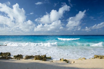 Turquoise Ocean Waves Crashing on Rocky Beach