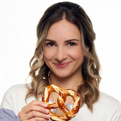 Woman holding giant pretzel