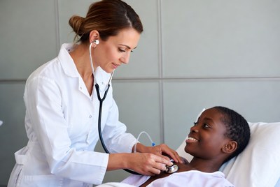 Nurse checking patient's heartbeat