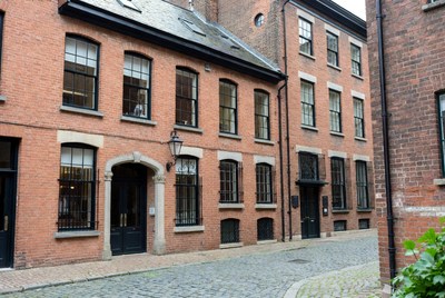 Historic Brick Row Houses on Cobblestone Street