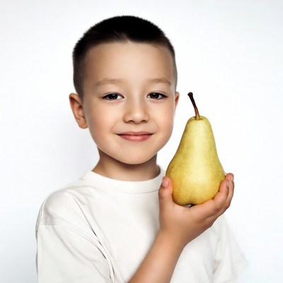 Boy holding green pear