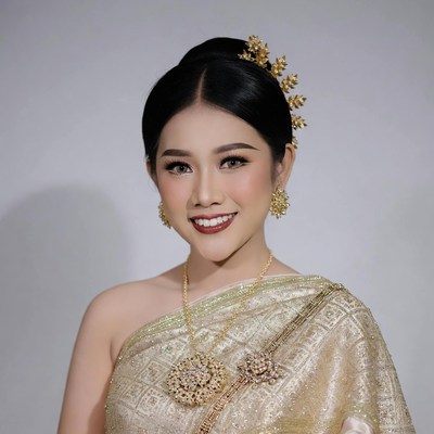 Thai woman in traditional gold Chut Thai