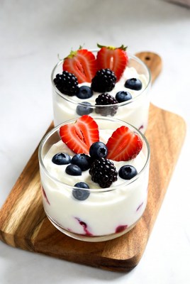 Berry Yogurt Parfaits on Wooden Board