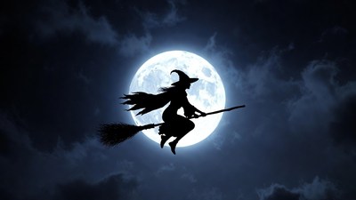 Silhouette witch flying on broomstick
