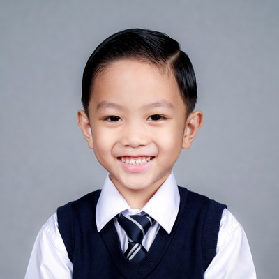 Asian boy smiling in school uniform