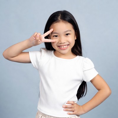 Asian girl making peace sign