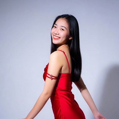 Asian woman in red dress walking