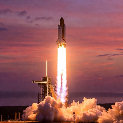Space Shuttle Launching at Sunset