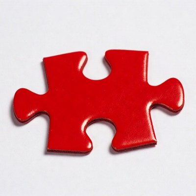 Red puzzle piece on white