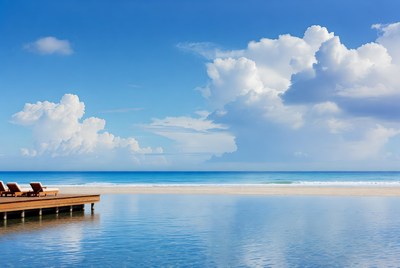 Wooden pier with chairs over tropical lagoon