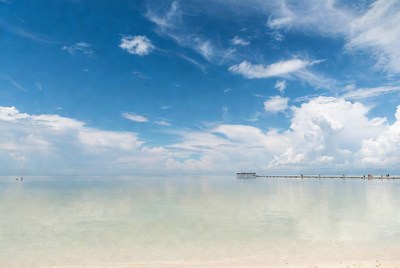 Pier extending into calm turquoise ocean
