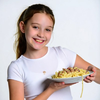 Girl holding spaghetti plate