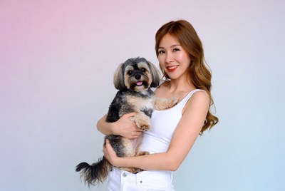 Asian woman holding Yorkshire Terrier
