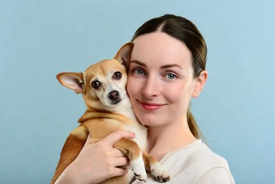 Woman holding chihuahua dog