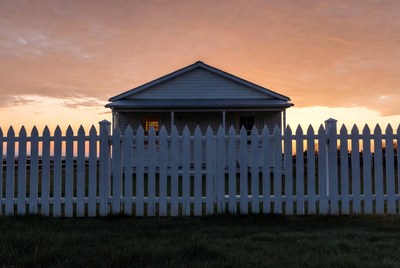 White Picket Fence House at Sunset