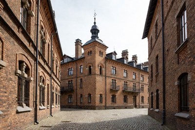 Brick Building in Cobblestone Courtyard