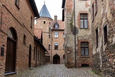 Medieval Brick Courtyard with Cobblestone Path
