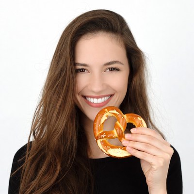 Woman holding giant pretzel