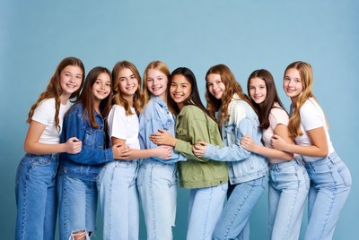 Group of teenage girls hugging
