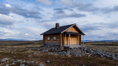 Log cabin in rocky mountain tundra