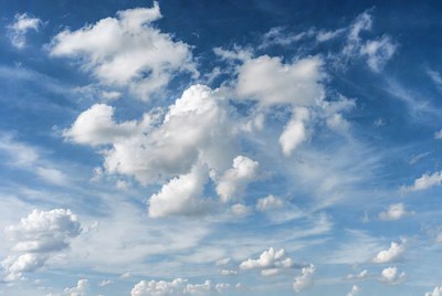 Fluffy White Clouds in Blue Sky