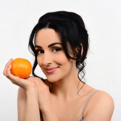 Woman holding orange