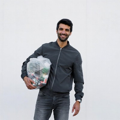 Man holding trash bag