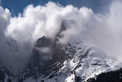 Snowy Mountain Peak in Clouds