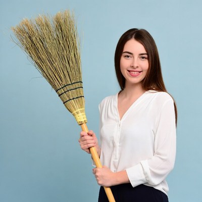 Woman holding broom