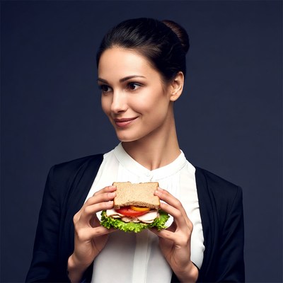 Woman holding sandwich