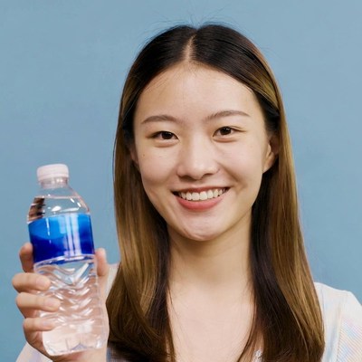Asian woman holding water bottle