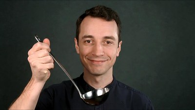 Man holding ladle smiling