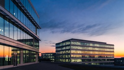 Modern glass office buildings at sunset